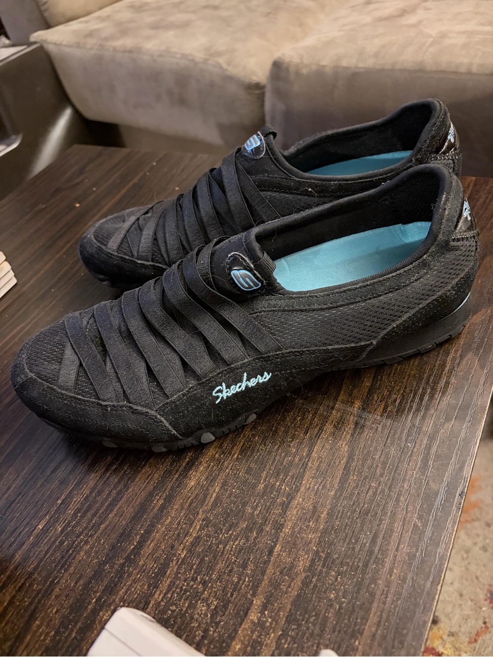 Skechers Women’s Black Slip-On Casual Sneakers with Blue Insole Accent